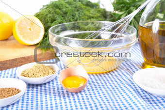 fresh mayonnaise ingredients on blue checkered tablecloth