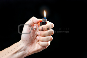 Hand Holding Lit Lighter