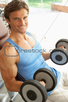 Man Working With Weights In Gym