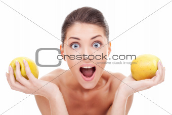 Surprised woman holding two apples