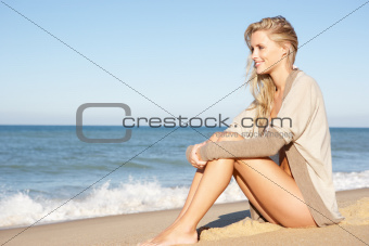 Young Woman Relaxing On Beach