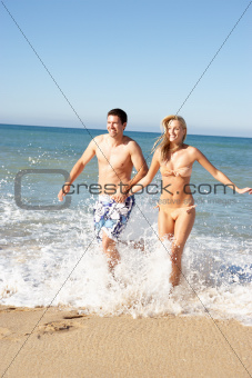 Young Couple Enjoying Beach Holiday