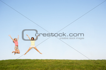 Young women jumping in air