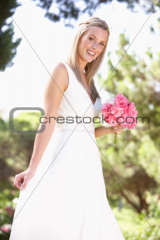 Bride Wearing Dress Holding Bouqet At Wedding