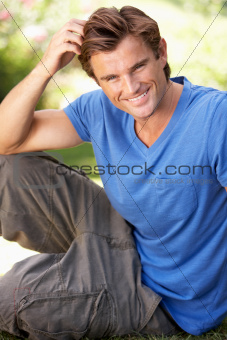 Portrait Of Young Man Relaxing In Park