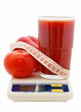 tomato juice, vegetables, measuring tape on electronic scale