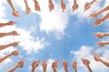 group of people with thumbs up on cloud background