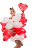 blonde girl with many balloons on her body. she smiles