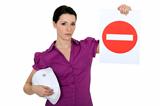 Woman holding a no entry sign