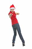 Smiling young woman in Santa hat pointing in camera