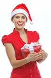 Happy young woman in Santa hat with Christmas present box