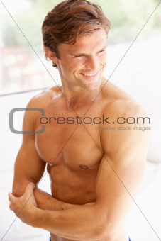 Portrait Of Bare Muscular Torso Of Young Man
