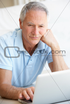 Senior man using laptop computer