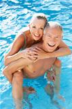 Senior couple having fun in pool