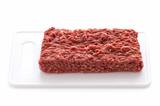minced beef on a white chopping board isolated