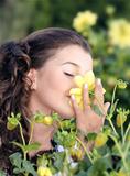 Girl smelling a flower