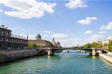 View of Palais de Justice and a bridge over the Seine river. Par
