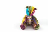 Handicraft colorful  bear on a white background
