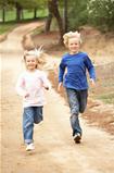 Two Children running in park