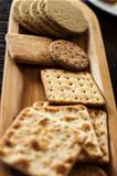 Various biscuits on a wooden plate