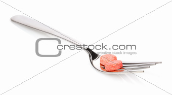 orange tablet on fork