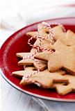Gingerbread stars on a red plate