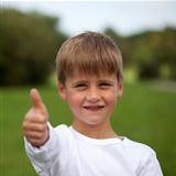Young boy showing thumbs up