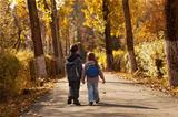 Kids walking in early autumn