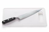 stainless steel kitchen knife and chopping board