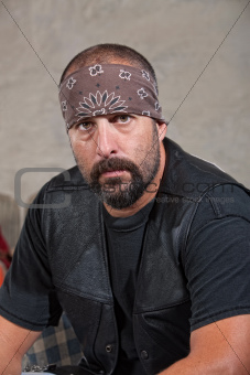 Serious Bearded Man in Leather Vest