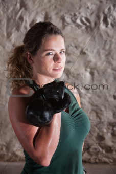 Strong Lady Holds Kettlebell