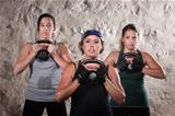 Ladies Lifting Kettlebells in Boot Camp Style Workout