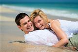 Happy young couple on tropical sands