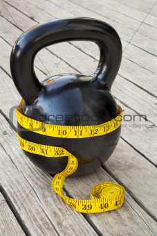 kettlebell and measuring tape