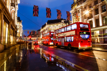 Red Bus on the Rainy Street of London in the Night, United Kingdom