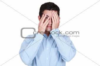 Young man covering eyes