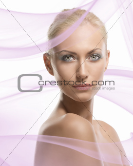 beauty portrait of blonde girl turned of three quarters