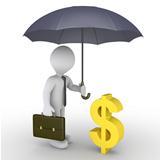 Businessman with umbrella protecting dollar