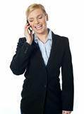 Corporate female communicating on phone