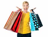 Young woman excited after tons of shopping