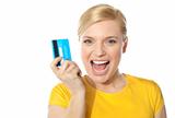 Blond sales girl posing with credit card