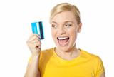 Smiling young girl holding debit-card
