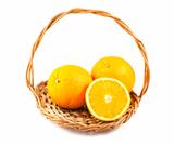 Ripe orange fruits in a wicker basket