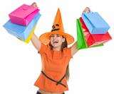Smiling woman in Halloween hat rising up shopping bags