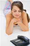 Young woman waiting phone call