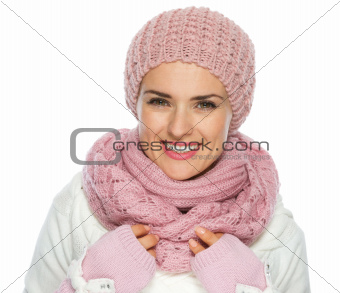 Portrait of happy woman in knit scarf, hat and mittens
