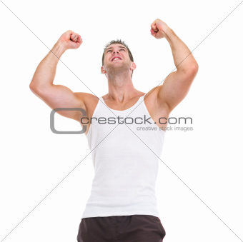 Happy male athlete rejoicing success