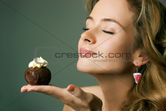 Young Blonde Woman Eating the Cake