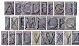 alphabet in grunge metal type