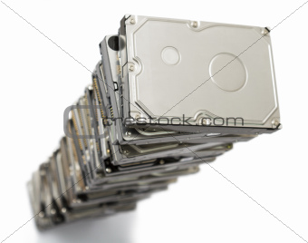 high stack of used hard drives